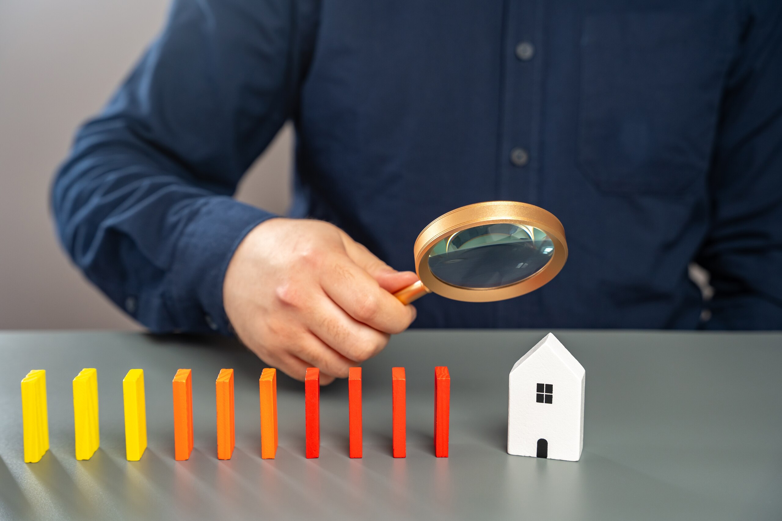 Wooden lock and people figures representing buyer protection under the Johnson v. Davis Florida property disclosure rule