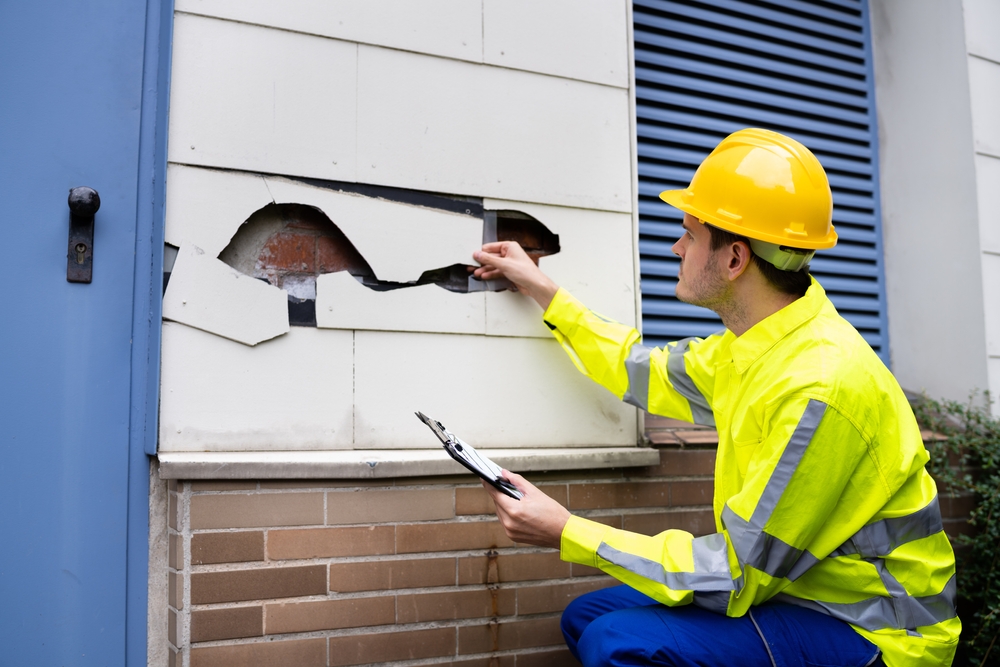 Home inspector looks for deeper damage beneath a cosmetic siding issue