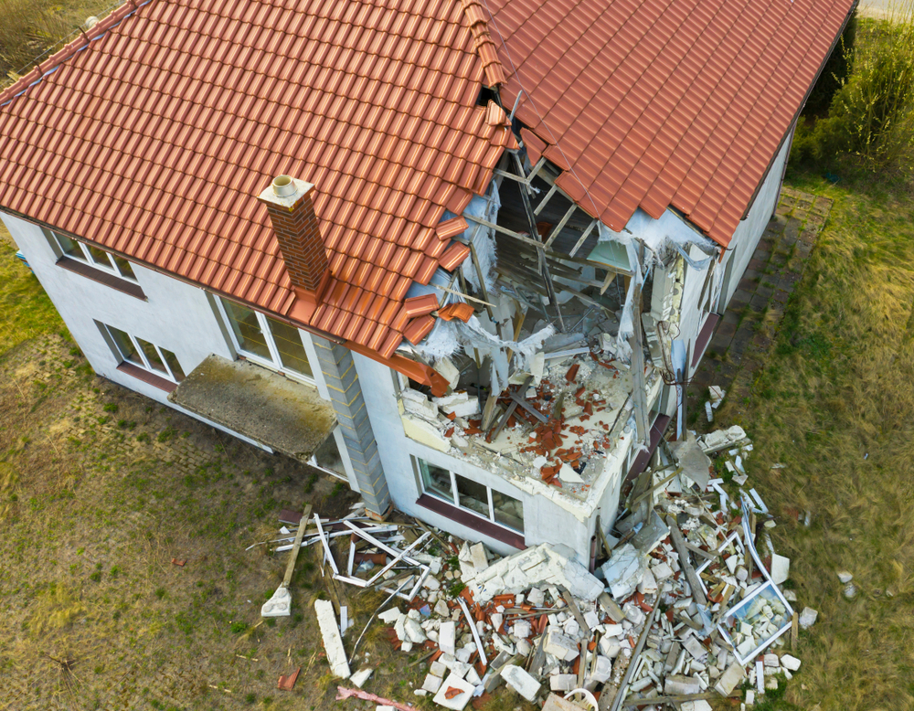 Structural damage to house that has led to collapse of corner of home